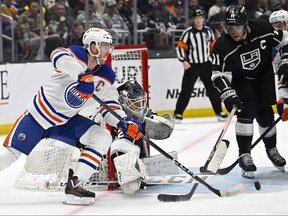 Apr 4, 2023; Los Angeles, California, USA; Los Angeles Kings goaltender Pheonix Copley (29) and center Anze Kopitar (11) defend Edmonton Oilers center Connor McDavid (97) in the third period at Crypto.com Arena.