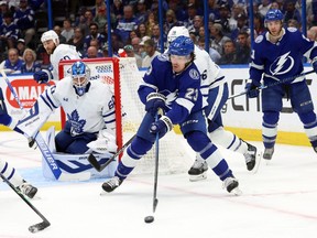 Apr 11, 2023; Tampa, Florida, USA; Tampa Bay Lightning center Michael Eyssimont (23) passes the puck against the Toronto Maple Leafs during the third period at Amalie Arena.