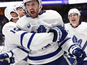 Apr 24, 2023; Tampa, Florida, USA;Toronto Maple Leafs center Alexander Kerfoot  celebrates after he scored the game-winning goal against the Tampa Bay Lightning in overtime of game four of the first round of the 2023 Stanley Cup Playoffs at Amalie Arena.