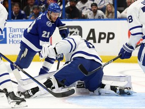 Tampa Bay Lightning center Brayden Point (21) shoots as Toronto Maple Leafs goaltender Joseph Woll (60) defends during the first period at Amalie Arena April 11, 2023. Kim Klement-USA TODAY Sports