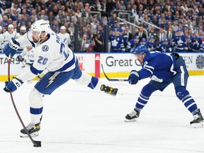 Tampa Bay Lightning winger Nicholas Paul  shoots the puck in front of Maple Leafs defenceman Justin Holl in Game 5 at Scotiabank Arena on Thursday. Holl was a minus-3 in the 4-2 Leafs loss and has been on for 13 of Tampa Bay's 19 even-strength goals.