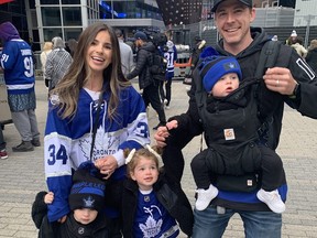 Ashley and Lee Johnston, of Markham, brought their three young children -- Olivia, 3, Leo, 2, Carter, 1 -- down to Scotiabank Arena for Game 1 between the Maple Leafs and Lightning.