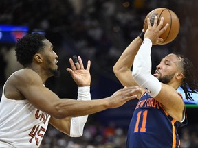 Cleveland Cavaliers guard Donovan Mitchell, left, defends New York Knicks guard Jalen Brunson in the third quarter during Game 5 of the 2023 NBA playoffs at Rocket Mortgage FieldHouse in Cleveland, Ohio, April 26, 2023.