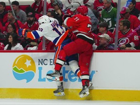 New York Islanders centre Mathew Barzal checks Carolina Hurricanes right wing Jesper Fast  during the second period in game two of the first round of the 2023 Stanley Cup Playoffs at PNC Arena in Raleigh, N.C., April 19, 2023.