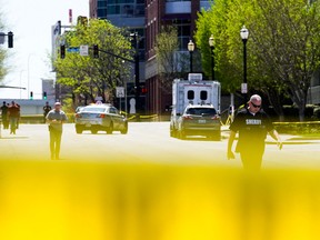 Police deploy at the scene of a mass shooting outside an Old National Bank branch near Slugger Field baseball stadium in downtown Louisville, Ky., U.S. April, 10, 2023.