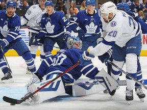 Lightning forward Nick Paul (20) skates the puck around Maple Leafs goaltender Joseph Woll during Game One of the First Round of the Stanley Cup Playoffs at Scotiabank Arena in Toronto, Tuesday, April 18, 2023.