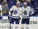 Maple Leafs John Tavares and  Mark Giordano look on during a playoff game.