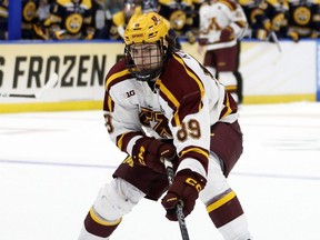 Matthew Knies of the Minnesota Golden Gophers looks to make a pass against the Quinnipiac Bobcats during the championship game of the 2023 Frozen Four at Amalie Arena in Tampa, Fla., Saturday, April 8, 2023.