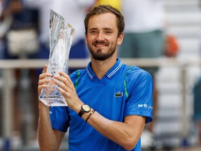 Daniil Medvedev celebrates with the Butch Buchholz Championship trophy after his victory over Jannik Sinner (ITA) (not pictured) in men's singles final of the Miami Open at Hard Rock stadium in Miami, Fla., April 2, 2023.