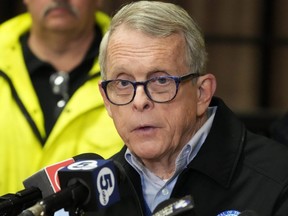 Ohio Gov. Mike DeWine meets with reporters after touring the Norfolk and Southern train derailment site in East Palestine, Ohio, Feb. 6, 2023.