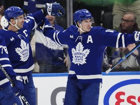 Maple Leafs' John Tavares (left) celebrates his goal against the Anaheim Ducks with Mitch Marner on Tuesday, Dec. 13, 2022.