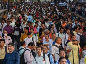 People crowd on platforms as they wait for their train at the Chhatrapati Shivaji Terminus railway station in Mumbai, India, on Wednesday, April 19, 2023.