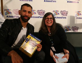 Rita DeMontis and then Toronto Blue Jay Jose Bautista with his boxes of cereal with his photo on the front on May 2, 2016. Dave Abel/Toronto Sun