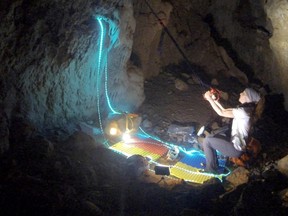 Beatriz Flamini, a Spanish mountaineer who has been isolated for 500 days in a cave is pictured during her daily life at the cave in Motril, Spain, in this screen grab taken from a handout video from November 2021. Dokumalia Producciones/Handout via REUTERS.