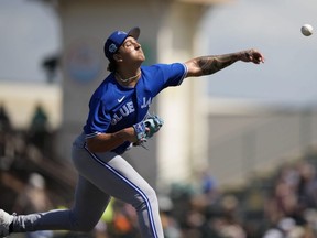 Blue Jays prospect Ricky Tiedemann throws in the fourth inning of a spring training game against the Pirates in Bradenton, Fla., March 7, 2023.
