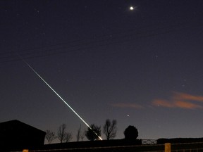 A meteorite creates a streak of light across the night sky over northern England, April 26, 2015.