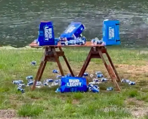 Kid Rock took aim at cases of Bud Light to protest the beer brand’s partnership with Dylan Mulvaney.