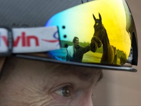 A thoroughbred horse's image is reflected off jockey Justin Stein's eyewear at Woodbine on April 21, 2023. The 2023 thoroughbred racing season opens at Woodbine on April 22, 2023.