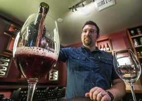 Jim Cunningham, Merkin Vineyards Old Town Scottsdale general manager, pours a glass of red wine during a wine tasting in Scottsdale. Ernest Doroszuk/Toronto Sun