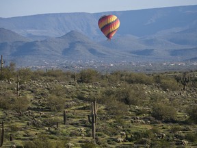 A hot air balloon is seen north of Scottsdale, Arizona, from a flight with Hot Air Expeditions.