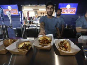 The poutine hotdog is a new offering at Rogers Centre this season. JACK BOLAND