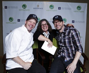 Rita DeMontis poses for a photo with Donnie Wahlberg (right) and Paul Wahlberg during an interview promoting their upcoming Wahlburgers restaurant in Toronto on September 7, 2013. Ernest Doroszuk/Toronto Sun