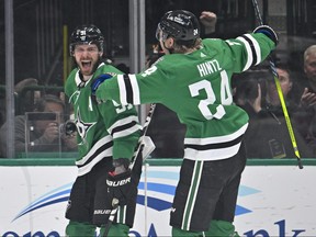 Dallas Stars centre Tyler Seguin, left, and centre Roope Hintz celebrate a power play goal scored by Seguin against the Minnesota Wild during the first period in Game 5 of the first round of the 2023 Stanley Cup Playoffs at American Airlines Center in Dallas, Texas, April 25, 2023.