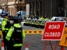 Police officers stand guard outside the Grand Central Hotel, where U.S. President Joe Biden is staying, as he visits Northern Ireland, in Belfast April 12, 2023.