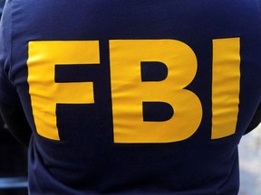 An FBI logo is pictured on an agent's shirt in the Manhattan borough of New York City, New York, October 19, 2021.