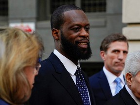Grammy Award-winning rapper Prakazrel "Pras" Michel of the hip hop group "The Fugees" leaves U.S. federal court with his attorneys after being convicted on criminal charges that he conspired with a Malaysian financier to orchestrate a series of foreign lobbying campaigns aimed at influencing the U.S. government in Washington, April 26, 2023.