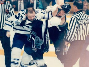 May 17, 1993. After years of sticking up for his teammates, Wendel now spends time with his kids.The message is a simple one: Don’t mess with Doug Gilmour. That’s what Leaf captain Wendel Clark explains to Marty McSorley last night at Maple Leaf Gardens after the Kings defenceman rocked Gilmour with a vicious cheap shot. The hit sparked a third-period brawl as the Leafs dominated the game. (File Photo)