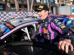 In this file photo taken on January 23, 2022 Irish driver Craig Breen celebrates his third place as he arrives in Monaco prior to the podium ceremony after the 90th WRC Monte-Carlo Rally, in Monaco.