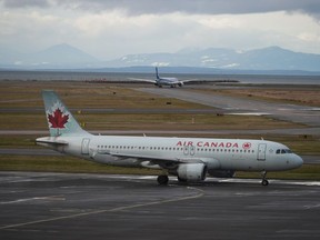 An Air Canada aircraft taxis at Vancouver International Airport after operations returned to normal after last week's snowstorm, in Richmond, B.C., Monday, Dec. 26, 2022. Air Canada announced that executive vice-president and CFO Amos Kazzaz is retiring at the end of June.