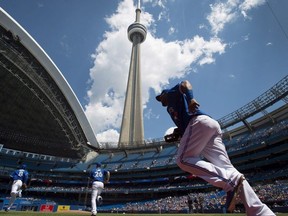 Members of the Toronto Blue Jays take to the field before MLB action against the Oakland Athletics in Toronto on Saturday, May 24, 2014.