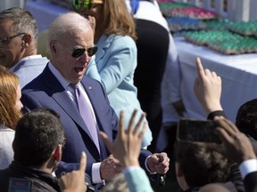 President Joe Biden greets guests at the 2023 White House Easter Egg Roll, Monday, April 10, 2023, in Washington.