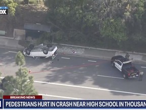 This frame grab from video provided by Fox 11 Los Angeles shows the scene where a teenager was killed and three others injured, Tuesday, April 18, 2023, when a stabbing suspect crashed his vehicle into the group as they were walking near their high school in Thousand Oaks, Calif.