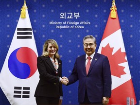 Foreign Minister Melanie Joly, left, shakes hands with South Korean Foreign Minister Park Jin prior to a meeting at the Foreign Ministry in Seoul, South Korea Saturday, April 15, 2023.