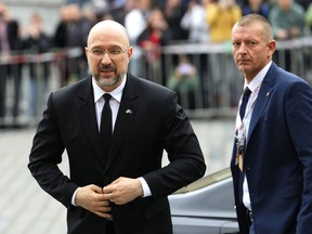 Ukrainian Prime Minister Denys Shmyhal, left, arrives for a meeting of the European Political Community at Prague Castle in Prague, Czech Republic, Thursday, Oct 6, 2022.