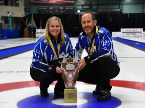 Jennifer Jones and Brent Laing pose with their gold medals and the Canadian Mixed Doubles Curling Championship trophy in Sudbury, Ont., in a March 26, 2023, handout photo.