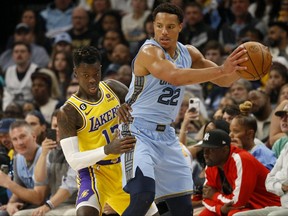 Memphis Grizzlies guard Desmond Bane, right, handles the ball as Los Angeles Lakers guard Dennis Schroder defends during the first half during game five of the 2023 NBA playoffs at FedExForum in Memphis, Tenn., April 26, 2023.