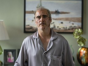 This image released by A24 shows Joaquin Phoenix in a scene from "Beau is Afraid."