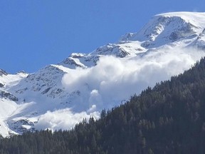 In this photo provided by Contamines Montjoie, an avalanche rolling down the Armancette glacier in Contamines-Montjoie, France, in the Haute-Savoie region, some 30 kilometers (almost 20 miles) southwest of Chamonix, Sunday April 9, 2023.
