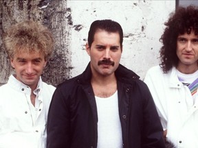 Queen's Freddie Mercury with Brian May and John Deacon.