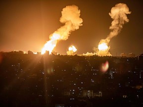 This picture taken early on April 7, 2023 shows explosions in Khan Yunis in the southern Gaza Strip during Israeli air strikes on the Palestinian enclave.