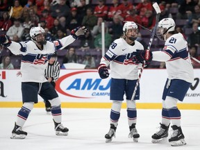 Team USA forward Amanda Kessel (28) celebrates her goal with teammates Hilary Knight (21) and Caroline Harvey (4) against Czechia during first period semifinal action at the IIHF Women's World Hockey Championship in Brampton, Ont., Saturday, April 15, 2023.