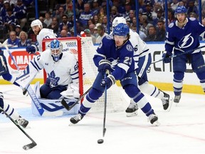 Apr 11, 2023; Tampa, Florida, USA; Tampa Bay Lightning center Michael Eyssimont passes the puck against the Toronto Maple Leafs during the third period at Amalie Arena.