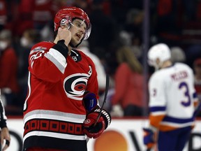 Carolina Hurricanes' Sebastian Aho (20) starts to take off his helmet following the Hurricane' loss to the New York Islanders in Game 5 of an NHL hockey Stanley Cup first-round playoff series in Raleigh, N.C., Tuesday, April 25, 2023.
