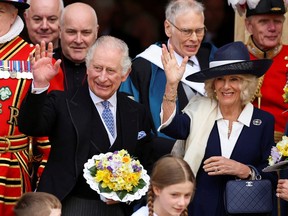 King Charles and Camilla, Queen Consort wave as they attend the Maundy Thursday Service at York Minster, in York, Britain, April 6, 2023.