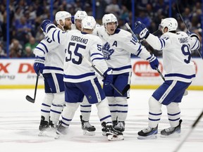 Morgan Rielly  of the Toronto Maple Leafs (centre) celebrates a goal in the third period during  Game 4 of the First Round of the 2023 Stanley Cup Playoffs against the Tampa Bay Lightning at Amalie Arena on April 24, 2023 in Tampa, Fla.