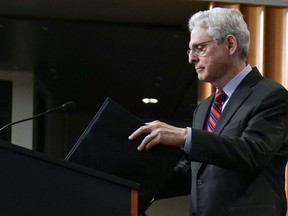 Attorney General Merrick Garland arrives to speak at the Department of Justice in Washington, Thursday, April 13, 2023.